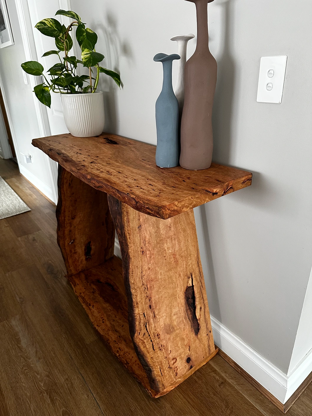 Salvaged timber hallway table styled in a home